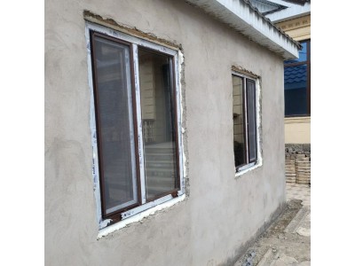 Новые коричневые металлопластиковые окна в дом